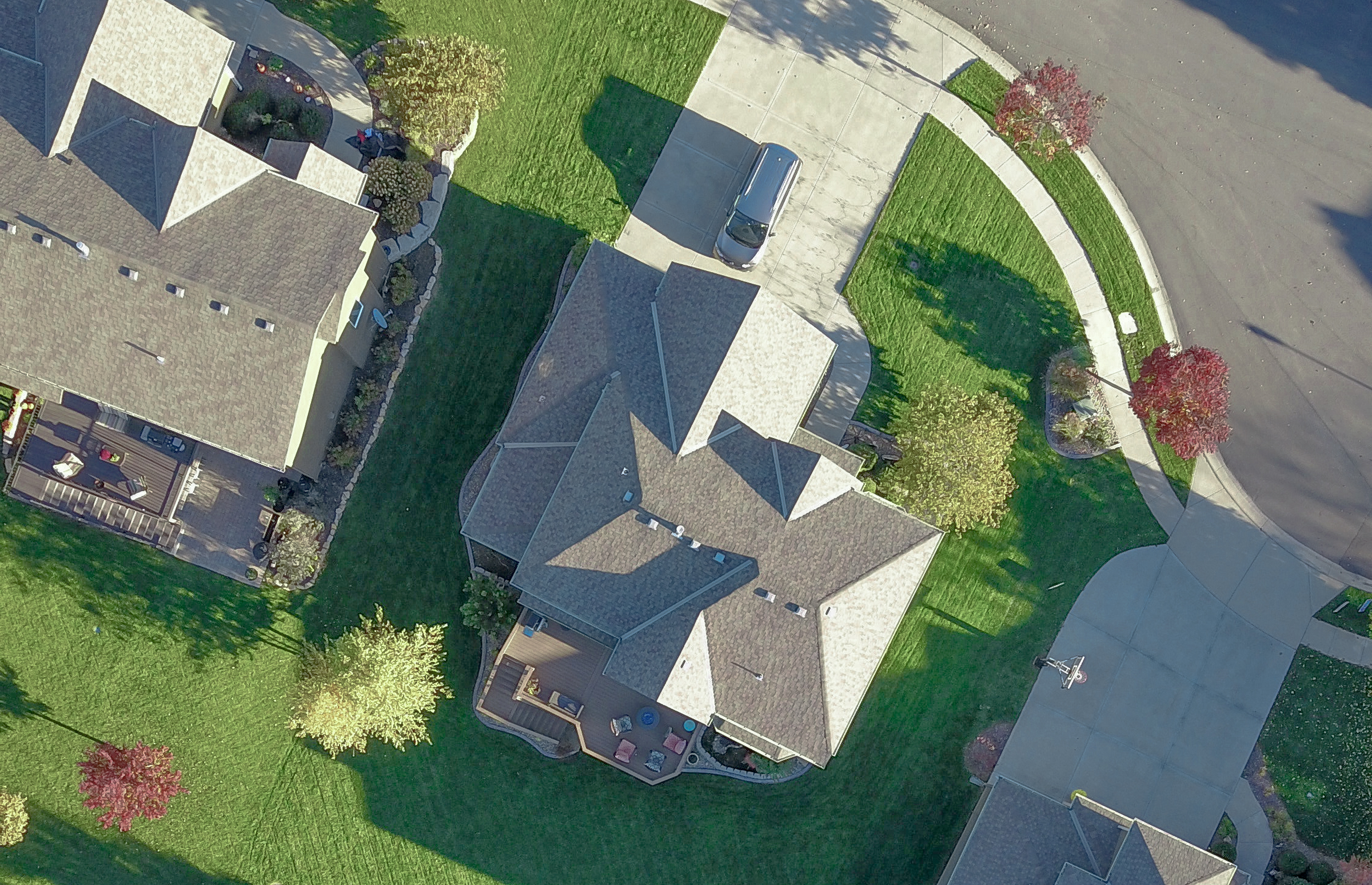 Overhead drone photo of a large house showcasing a roof inspection