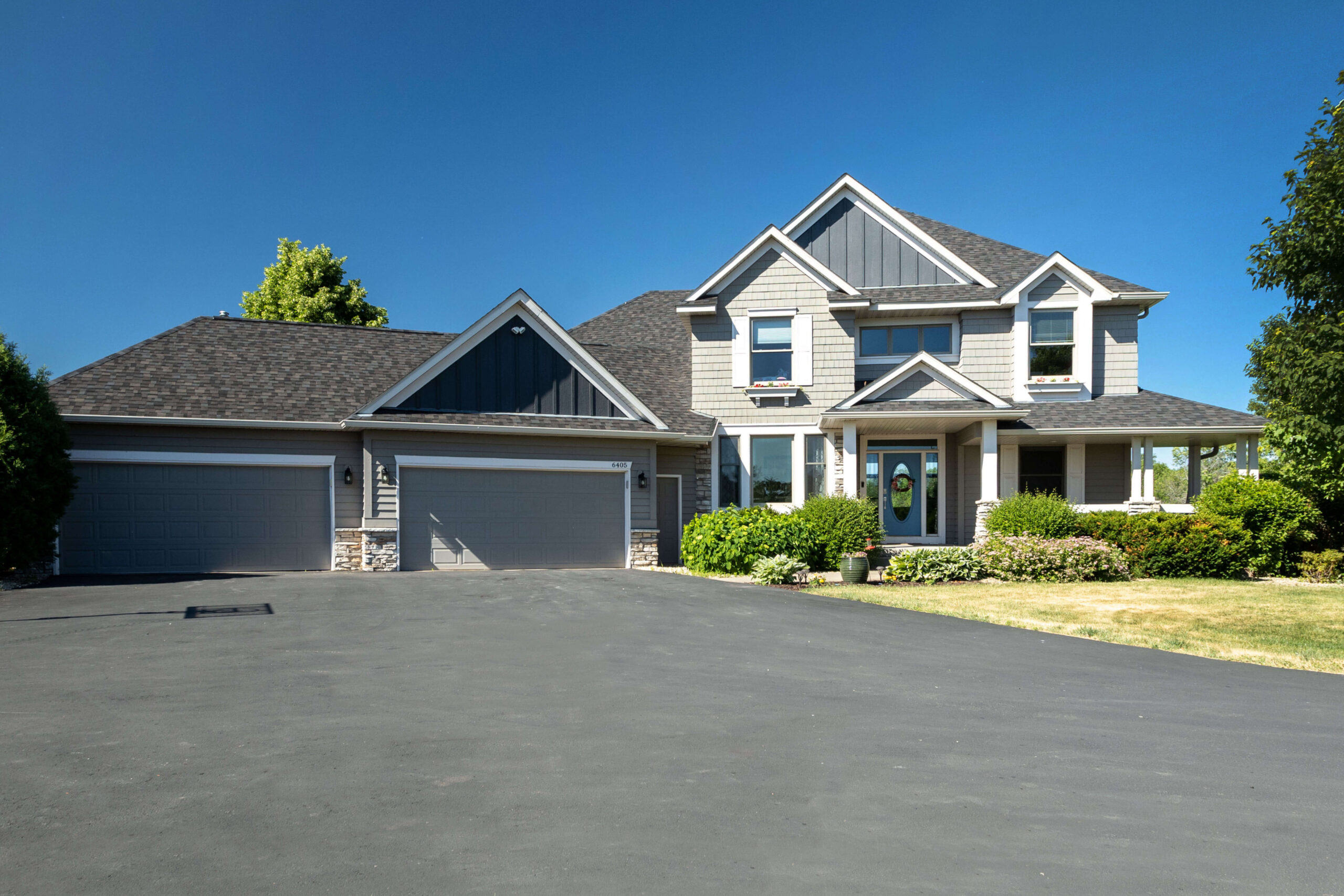 Beautiful home with two 2-car garages and a sealed, clean driveway