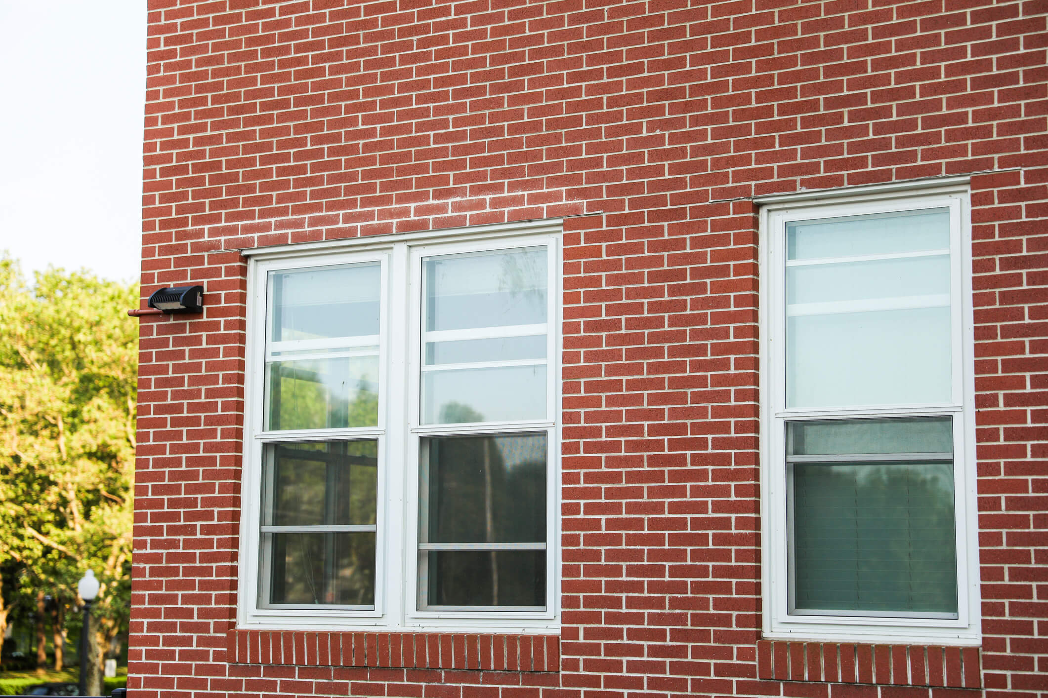 single and double hung windows on a brick building
