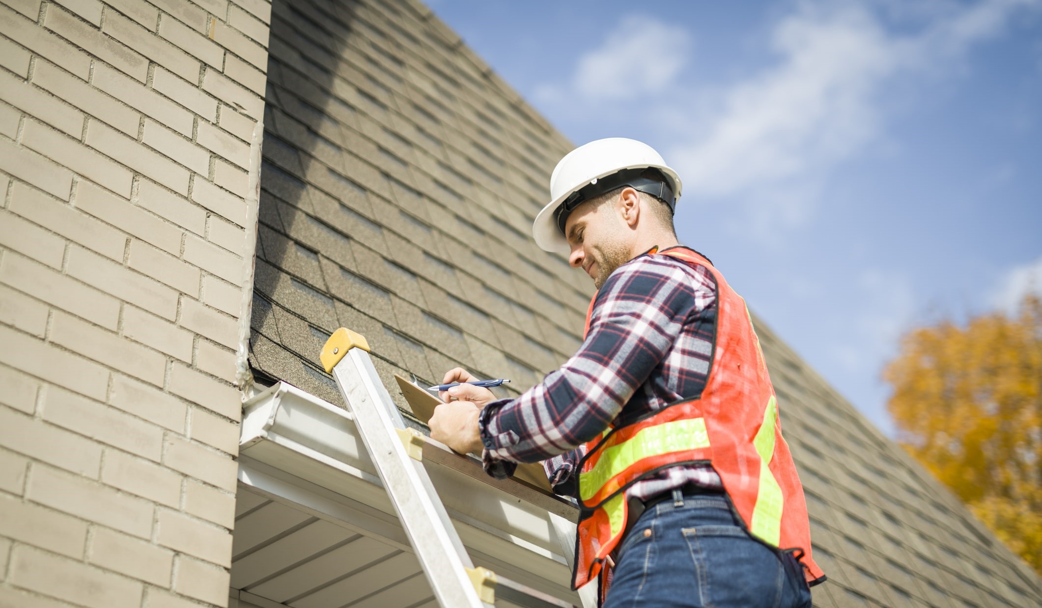 professional contractor performing a residential roof inspection