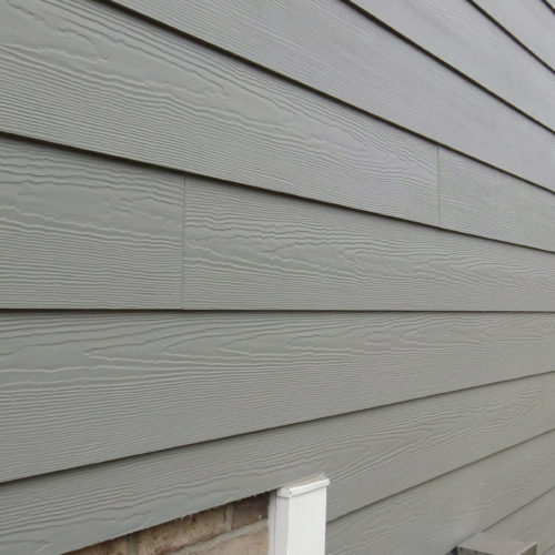 Image of brown vinyl siding on a house.