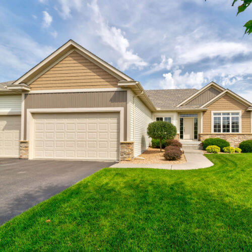 Ranch-style residential home adorned with pristine vinyl siding.