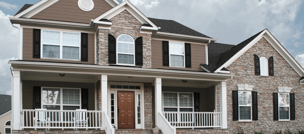 Residential home featuring durable manufactured stone siding.