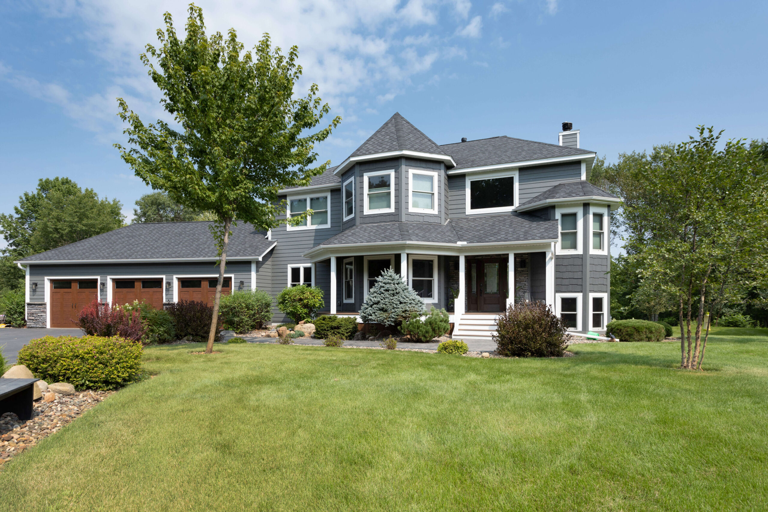 Large gray home and front yard